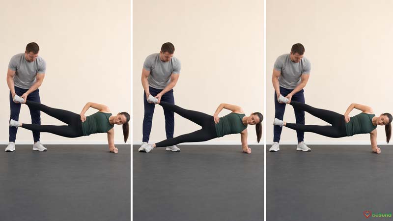 A female athlete performs three stages of a partner-assisted Copenhagen plank while a standing partner supports her upper leg.
